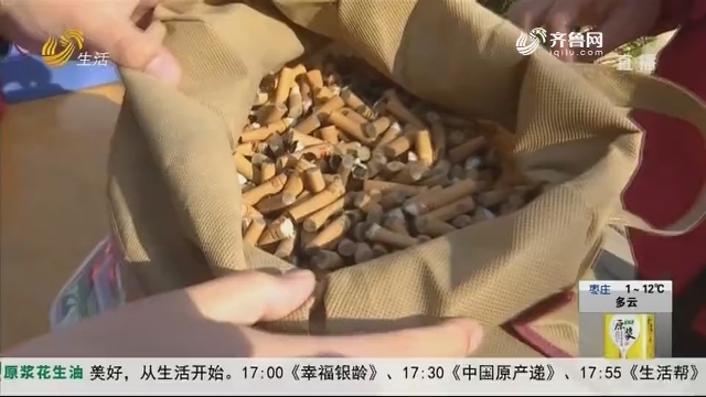 济南：环保新方式 捡烟头换鸡蛋